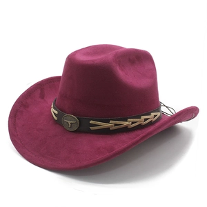 Close-up of wine red suede cowboy hat featuring leather band with bull emblem