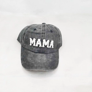 Detail of vintage gray washed baseball cap featuring white MAMA towel embroidery