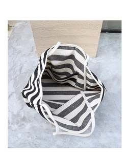 Top view of striped canvas tote bag showing inner pocket and spacious interior