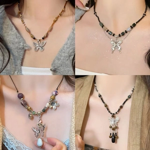 Retro faux leather beaded necklace with sun star and butterfly pendant on model neck