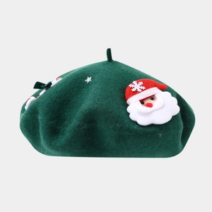 Detail of dark green wool beret featuring a 3D Santa Claus figure and silver stars