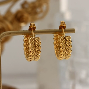 Chic 18K gold plated C-shaped hoop earrings with wheat pattern on a metal stand