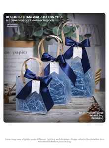 Three sizes of frosted gift bags with blue ribbon and Happy Teachers Day tags