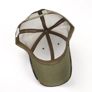 Detail of adjustable snapback closure and breathable mesh on camouflage trucker hat