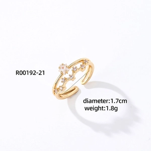 Detailed view of adjustable gold star ring with cubic zirconia stones and size specs