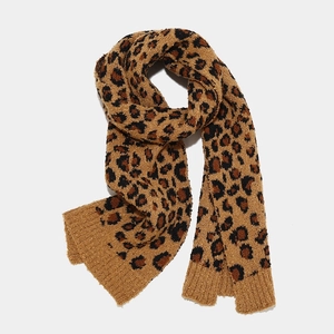 Detail of leopard print knitted scarf with rib-knit edges for winter warmth