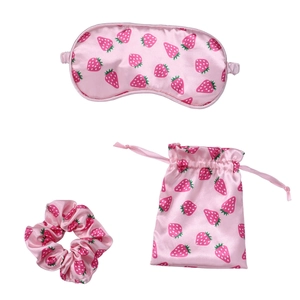 Pink silk strawberry sleep set including eye mask, scrunchie and drawstring pouch