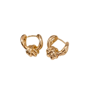 Minimalist gold-colored twisted knot earrings with polished finish and elegant design
