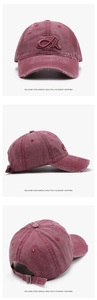 Detailed views of washed red baseball cap with 3D letter A embroidery and distressed holes