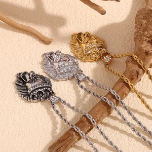 Detailed view of hip hop lion crown pendants in gold, silver, and black finishes