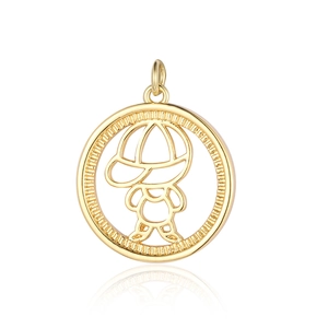 Macro detail of golden round pendant with engraved cartoon boy line art on white surface