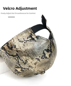Detail of adjustable velcro strap on faux snakeskin leather baseball cap with gold texture