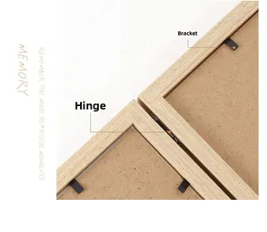 Detail of metal hinges and black tabs on minimalist natural wood triple picture frame