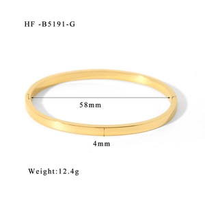 Detailed view of 58mm 18K gold plated titanium bangle with 4mm width and 12.4g weight