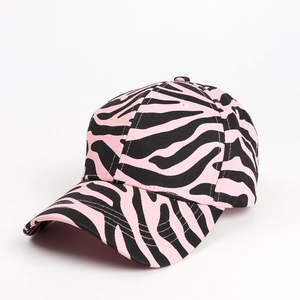 Close-up of pink zebra print baseball cap showing diagonal twill texture and stitching