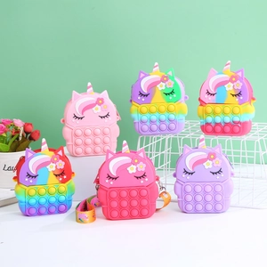 Unicorn pop-it silicone crossbody purse for kids in various rainbow and pastel colors