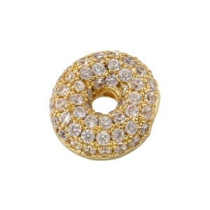 Detailed view of a gold-plated circular charm with micro-pave sparkling cubic zirconia