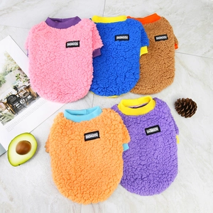 Five colors of soft fleece dog sweaters in pink blue brown orange and purple