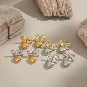 Two-tone stainless steel bow and heart earrings in gold and silver finish set