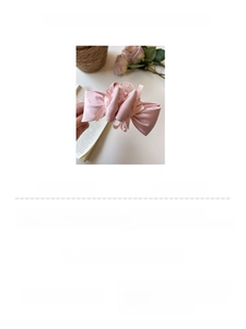 Detailed close-up of a 13cm layered pink chiffon bow hair claw clip for women