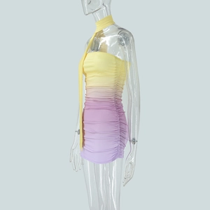 Detail view of the yellow to purple gradient dress with side ruching and glossy finish