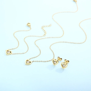 Gold stainless steel hollow heart jewelry set with necklace and stud earrings