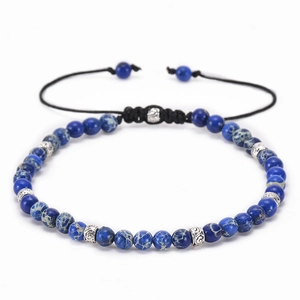 Detail of 4mm blue natural stone bead bracelet with adjustable woven knot cord