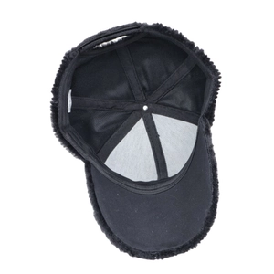 Detail view of the black plush baseball cap interior with stitching and wash label