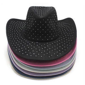 Detail view of stacked Y2K western cowboy hats with rhinestone accents in multiple colors