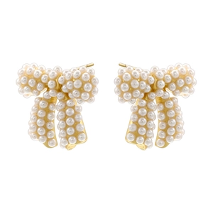 Golden bow stud earrings featuring white pearl inlay and pavé zircon details