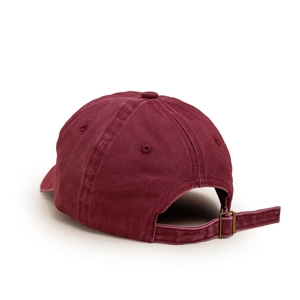 Macro detail of wine red cotton baseball cap with adjustable metal buckle on the back