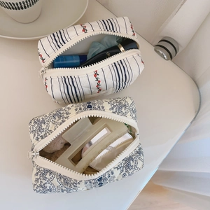 Quilted floral makeup bag detail showing spacious interior storage for skincare items