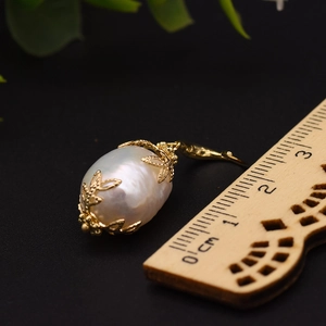 Elegant 2cm baroque pearl earrings with golden leaf filigree setting and 18k gold plating