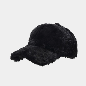 Close-up of thick black plush faux fur material on a winter baseball cap texture