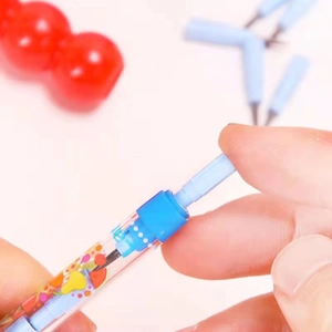 Macro detail of multi-functional pencil with fruit patterns and detachable lead sections