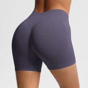 Close-up of high-waist seamless gym shorts showing peach lift stitching and breathable texture