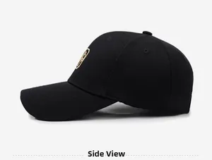 Side view of black structured mesh baseball cap with gold shield embroidery detail