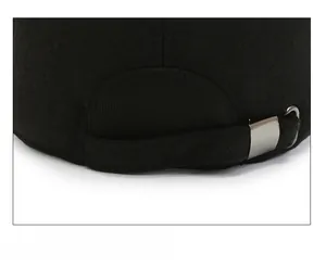Detail of adjustable metal buckle and strap on back of winter baseball cap