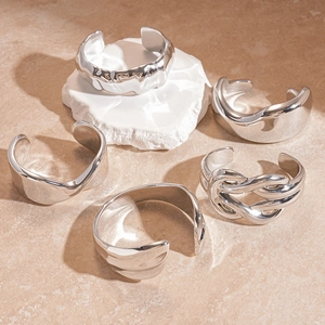 Five-piece silver textured cuff bracelet set with geometric liquid metal finish and ripples