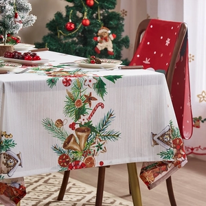Festive Christmas tablecloth featuring pine branches and gingerbread man holiday patterns