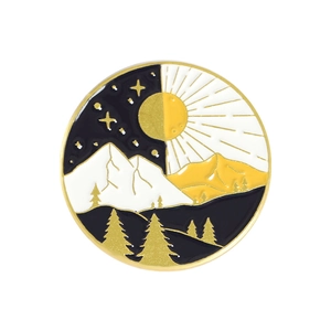 Detail of round enamel pin showing day and night mountain landscape in black, white, and gold