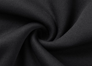 Close-up of premium black knit hoodie fabric with a soft and detailed macro texture