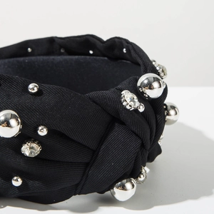 Detail of black knotted headband with silver beads and sparkling rhinestones craft