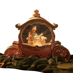 Vintage princess carriage music box with glowing crystal ball and intricate carvings