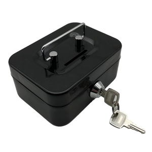 Detail of a portable black metal cash box featuring a top handle, coin slot, and key lock