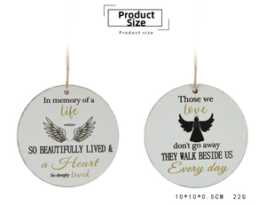 Detail of round wooden Christmas ornaments with angel wings and gold memorial inscriptions