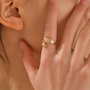 Vintage style gold stainless steel leaf ring with adjustable open design on finger