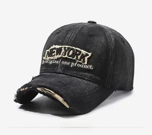 Side view of black distressed denim baseball cap with New York vintage patch embroidery