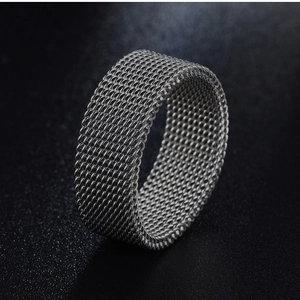 Macro shot of 8mm silver stainless steel mesh weave ring with modern industrial texture
