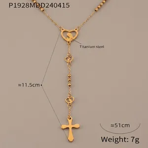Detailed view of titanium steel Y-necklace with heart medal and cross pendant charms